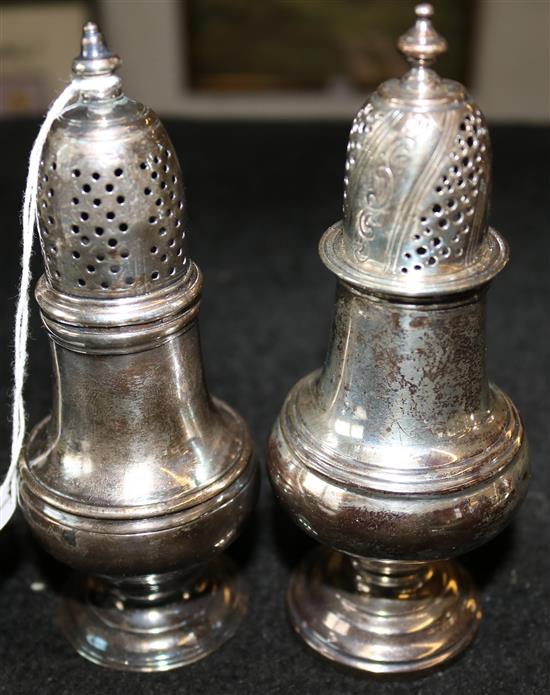 George III silver baluster caster and a similar George V caste(-)